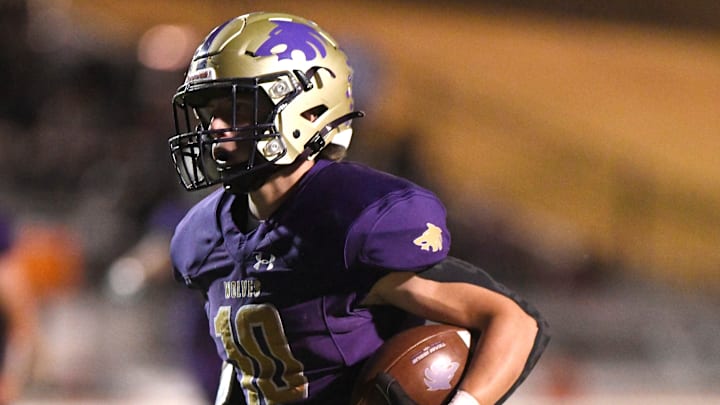 Dalhart's Hunter Trusler runs with the ball against Denver City in the Class 3A Division I bi-district football game, Thursday, Nov. 9, 2023, at Lowrey Field at PlainsCapital Park. Dalhart's Hunter Trusler runs with the ball against Denver City in the Class 3A Division I bi-district football game, Thursday, Nov. 9, 2023, at Lowrey Field at PlainsCapital Park.