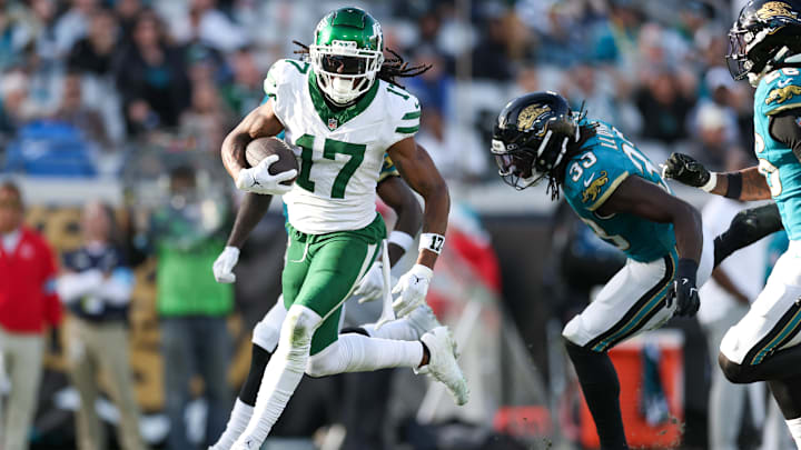 Dec 15, 2024; Jacksonville, Florida, USA; =New York Jets wide receiver Davante Adams (17) receives a pass for a touchdown against the Jacksonville Jaguars in the fourth quarter at EverBank Stadium.