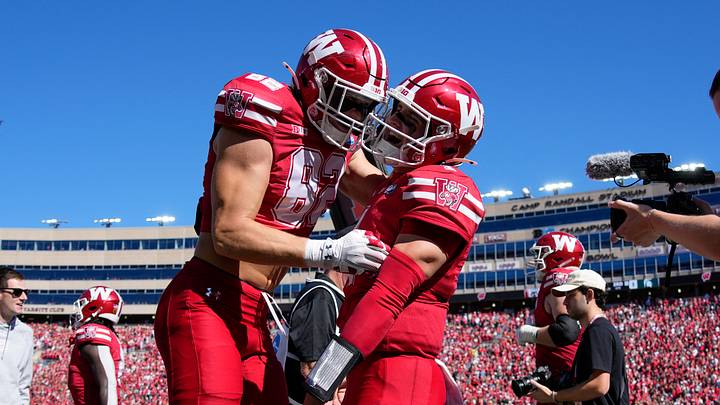 Oct 3, 2026; Madison, Wisconsin, USA;  Wisconsin Badgers quarterback Colton Joseph (1) celebrates with tight end Emmett Bork (82) after scoring a touchdown during the third quarter against the Michigan State Spartans at Camp Randall Stadium. Mandatory Credit: Jeff Hanisch-Imagn Images