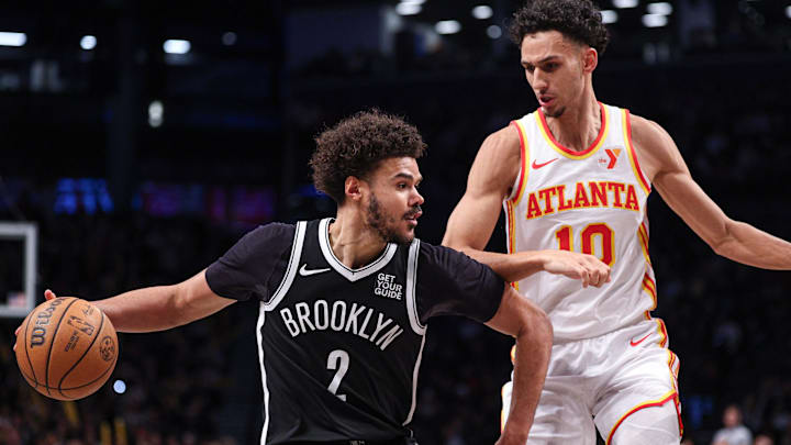 Mar 16, 2025; Brooklyn, New York, USA; Brooklyn Nets forward Cameron Johnson (2) is defended by Atlanta Hawks forward Zaccharie Risacher (10) during the second half at Barclays Center. Mandatory Credit: Vincent Carchietta-Imagn Images Mar 16, 2025; Brooklyn, New York, USA; Brooklyn Nets forward Cameron Johnson (2) is defended by Atlanta Hawks forward Zaccharie Risacher (10) during the second half at Barclays Center. Mandatory Credit: Vincent Carchietta-Imagn Images