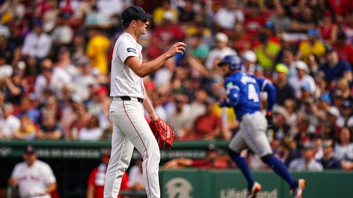 Aug 26, 2024; Boston, Massachusetts, USA; Toronto Blue Jays right fielder George Springer (4) hits a home run against Boston Red Sox starting pitcher Nick Pivetta (37) in the seventh inning at Fenway Park. Mandatory Credit: David Butler II-Imagn Images
