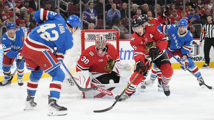 Dec 10, 2025; Chicago, Illinois, USA; New York Rangers center Noah Laba (42) shoots the puck on Chicago Blackhawks goaltender Spencer Knight (30) during the third period at United Center. Mandatory Credit: David Banks-Imagn Images Dec 10, 2025; Chicago, Illinois, USA; New York Rangers center Noah Laba (42) shoots the puck on Chicago Blackhawks goaltender Spencer Knight (30) during the third period at United Center. Mandatory Credit: David Banks-Imagn Images