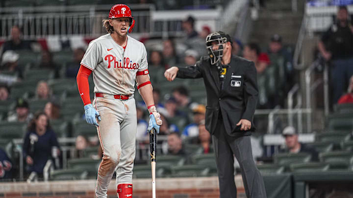 Apr 9, 2025; Cumberland, Georgia, USA; Philadelphia Phillies third base Alec Bohm (28) reacts after being called out on strikes against the Atlanta Braves during the ninth inning at Truist Park.