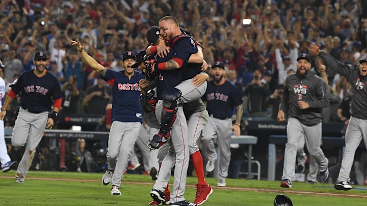 Oct 28, 2018; Los Angeles, CA, USA; Boston Red Sox pitcher Chris Sale (left) celebrates with teammates including catcher Christian Vazquez after defeating the Los Angeles Dodgers in game five of the 2018 World Series at Dodger Stadium. Mandatory Credit: Jayne Kamin-Oncea-Imagn Images