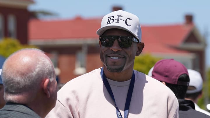 Jun 3, 2023; San Francisco, California, USA; Golden State Warriors former player Andre Iguodala speaks with a fan during the Bay FC Day for the Bay event at Presidio Main Post Lawn. Mandatory Credit: Darren Yamashita-USA TODAY Sports