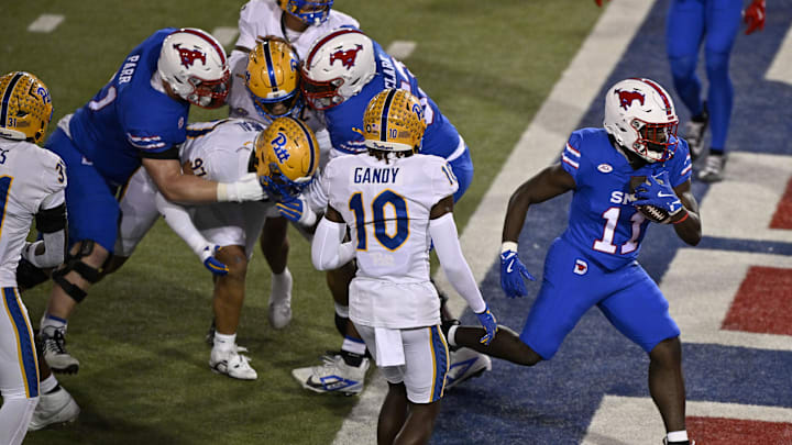 Nov 2, 2024; Dallas, Texas, USA; Southern Methodist Mustangs running back LJ Johnson Jr. (11) scores a touchdown against the Pittsburgh Panthers during the first half at Gerald J. Ford Stadium. Mandatory Credit: Jerome Miron-Imagn Images