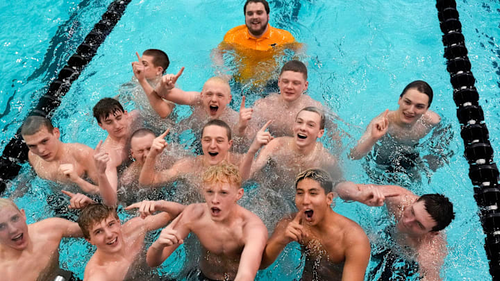 Dubuque Hempstead and coaches dove into the pool after the team’s first-place finish at the IHSAA boys state swim meet Saturday, Feb. 15, 2025 in Iowa City, Iowa.IHSAA boys state swim meet Saturday, Feb. 15, 2025 in Iowa City, Iowa.