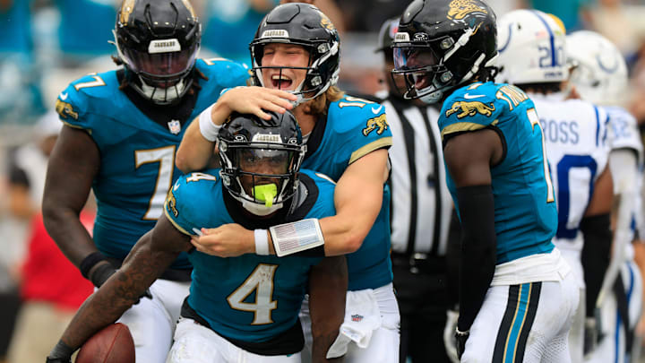 Jacksonville Jaguars quarterback Trevor Lawrence (16) celebrates a touchdown scored by running back Tank Bigsby (4) during the third quarter of NFL football matchup Sunday, Oct. 6, 2024 at EverBank Stadium in Jacksonville, Fla. [Corey Perrine/Florida Times-Union]