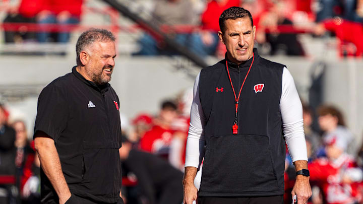 Nov 23, 2024; Lincoln, Nebraska, USA; Nebraska Cornhuskers head coach Matt Rhule and Wisconsin Badgers head coach Luke Fickell talk before a game at Memorial Stadium.