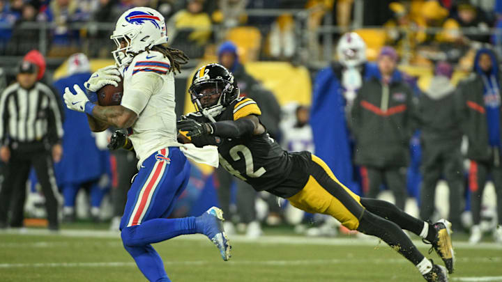 Nov 30, 2025; Pittsburgh, Pennsylvania, USA; Pittsburgh Steelers cornerback James Pierre (42) tackles Buffalo Bills running back James Cook III (4) during the second half at Acrisure Stadium. Mandatory Credit: Barry Reeger-Imagn Images