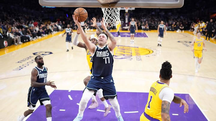 Jan 17, 2024; Los Angeles, California, USA; Dallas Mavericks guard Luka Doncic (77) shoots the ball against the Los Angeles Lakers in the first half at Crypto.com Arena. Mandatory Credit: Kirby Lee-Imagn Images Jan 17, 2024; Los Angeles, California, USA; Dallas Mavericks guard Luka Doncic (77) shoots the ball against the Los Angeles Lakers in the first half at Crypto.com Arena. Mandatory Credit: Kirby Lee-Imagn Images