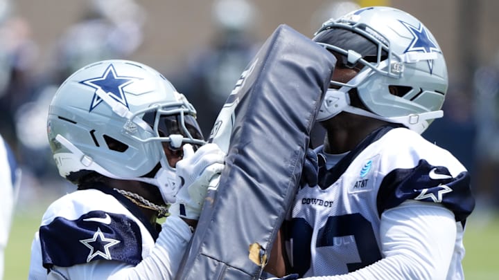 Dallas Cowboys running backs Miles Sanders and Javonte Williams participate.