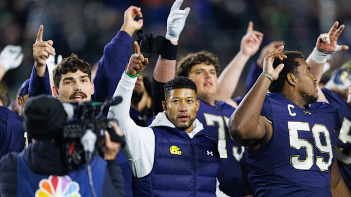 Notre Dame head coach Marcus Freeman celebrates with his players after winning a NCAA football game 70-7 against Syracuse at Notre Dame Stadium in South Bend. Notre Dame head coach Marcus Freeman celebrates with his players after winning a NCAA football game 70-7 against Syracuse at Notre Dame Stadium in South Bend.