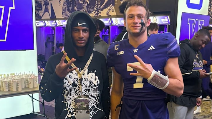 Terrance Saryon and UW QB Will Rogers share a moment after the USC game at Husky Stadium. 