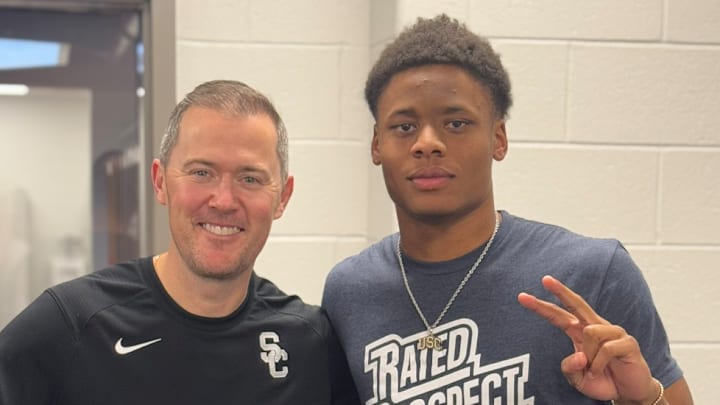USC head coach Lincoln Riley with five-star defensive athlete Xavier Griffin