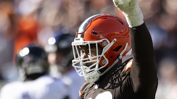 Oct 27, 2024; Cleveland, Ohio, USA; Cleveland Browns defensive end Za'Darius Smith (99) celebrates against the Baltimore Ravens during the third quarter at Huntington Bank Field. Mandatory Credit: Scott Galvin-Imagn Images
