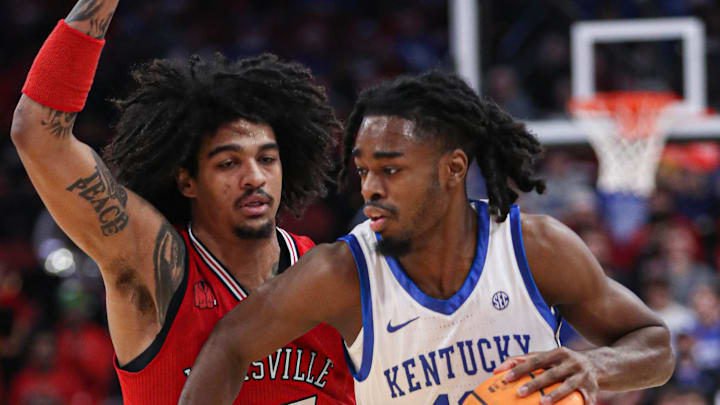 Louisville   s Skyy Clark guards Kentucky   s Antonio Reeves in the first half at the KFC Yum! Center on Thursday, December 21, 2023