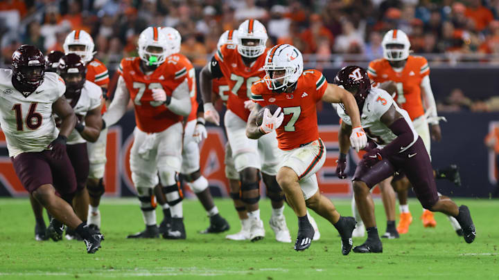 Sep 27, 2024; Miami Gardens, Florida, USA; Miami Hurricanes wide receiver Xavier Restrepo (7) runs with the football against the Virginia Tech Hokies during the third quarter at Hard Rock Stadium. Mandatory Credit: Sam Navarro-Imagn Images