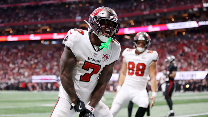 Sep 7, 2025; Atlanta, Georgia, USA; Tampa Bay Buccaneers running back Bucky Irving (7) celebrates after scoring a touchdown against the Atlanta Falcons during the third quarter at Mercedes-Benz Stadium. 