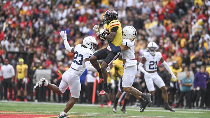 Maryland Terrapins wide receiver Tai Felton (10) catches as pass between Penn State Nittany Lions defensive end Dani Dennis-Sutton (33) and Jaylen Reed (1) during their 2023 Big Ten game. Maryland Terrapins wide receiver Tai Felton (10) catches as pass between Penn State Nittany Lions defensive end Dani Dennis-Sutton (33) and Jaylen Reed (1) during their 2023 Big Ten game.