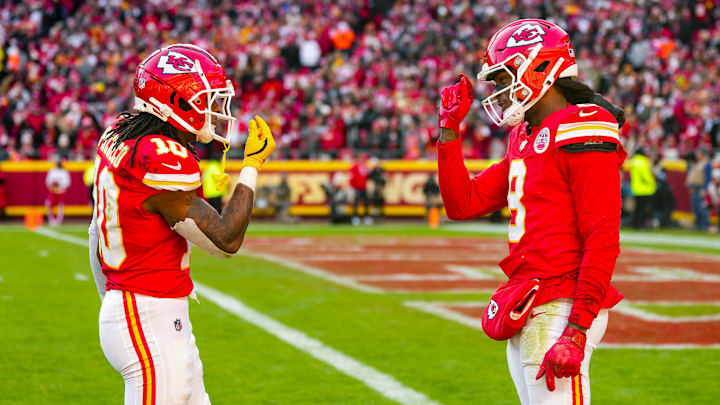 Nov 29, 2024; Kansas City, Missouri, USA; Kansas City Chiefs running back Isiah Pacheco (10) and wide receiver DeAndre Hopkins (8) react after a play during the first half against the Las Vegas Raiders at GEHA Field at Arrowhead Stadium. Mandatory Credit: Jay Biggerstaff-Imagn Images