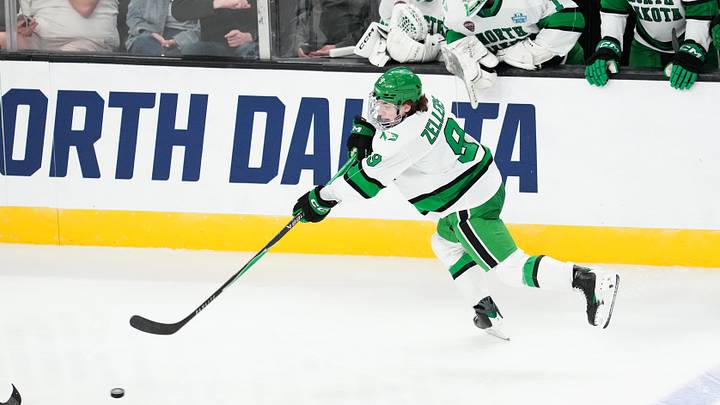 Apr 9, 2026; Las Vegas, Nevada, UNITED STATES; North Dakota Fighting Hawks forward Will Zellers (9) passes the puck in the second period against the Wisconsin Badgers in the semifinals of the NCAA men's ice hockey Frozen Four at T-Mobile Arena. Mandatory Credit: Stephen R. Sylvanie-Imagn Images Apr 9, 2026; Las Vegas, Nevada, UNITED STATES; North Dakota Fighting Hawks forward Will Zellers (9) passes the puck in the second period against the Wisconsin Badgers in the semifinals of the NCAA men's ice hockey Frozen Four at T-Mobile Arena. Mandatory Credit: Stephen R. Sylvanie-Imagn Images