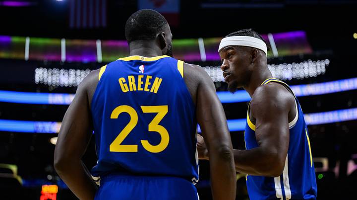 Oct 21, 2025; Los Angeles, California, USA; Golden State Warriors forward Jimmy Butler III (10) talks to forward Draymond Green (23) during the first half against the Los Angeles Lakers at Crypto.com Arena. Mandatory Credit: William Liang-Imagn Images
