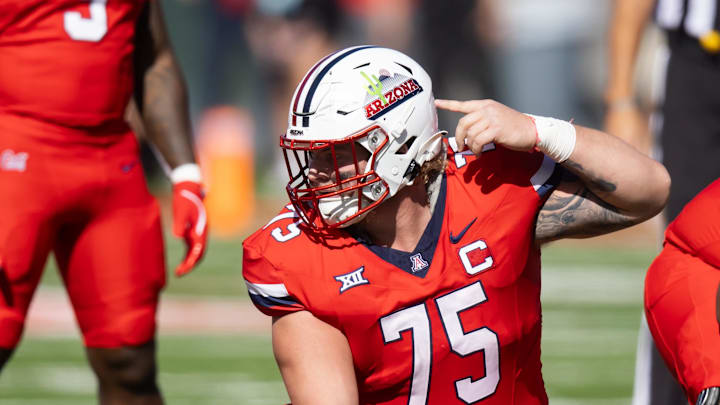 Oct 19, 2024; Tucson, Arizona, USA; Arizona Wildcats offensive lineman Josh Baker (75) against the Colorado Buffalos at Arizona Stadium. Mandatory Credit: Mark J. Rebilas-Imagn Images