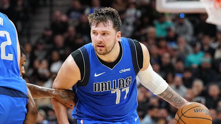 Mar 19, 2024; San Antonio, Texas, USA;  Dallas Mavericks guard Luka Doncic (77) dribbles to the basket against the Spurs. 