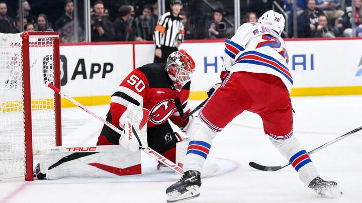 Oct 15, 2026; Newark, New Jersey, USA;  New Jersey Devils goaltender Nico Daws (50) makes a save against New York Rangers right wing Oliver Bjorkstrand (28) during the third period at Prudential Center.  Mandatory Credit: John Jones-Imagn Images