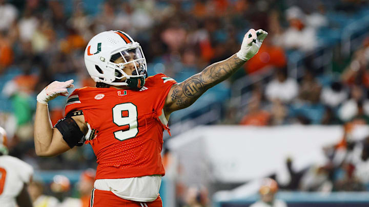 Sep 7, 2024; Miami Gardens, Florida, USA; Miami Hurricanes defensive lineman Tyler Baron (9) celebrates after sacking Florida A&M Rattlers quarterback Daniel Richardson (not pictured) during the third quarter at Hard Rock Stadium. Mandatory Credit: Sam Navarro-Imagn Images