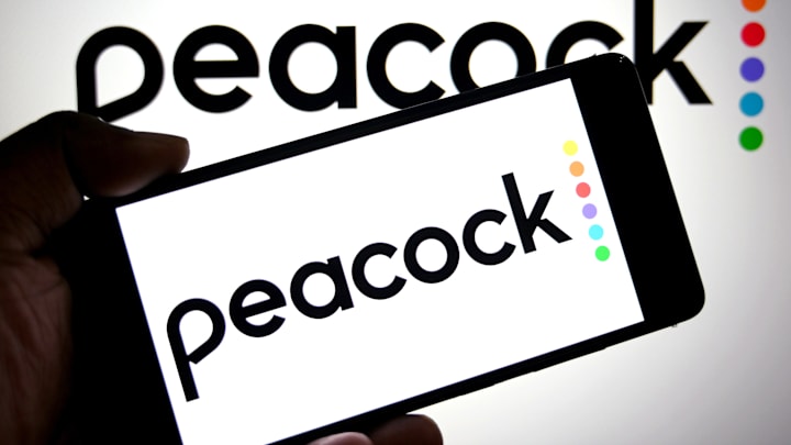 In this photo illustration, a Peacock logo is seen displayed...