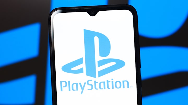 In this photo illustration, the PlayStation (PS) logo is...