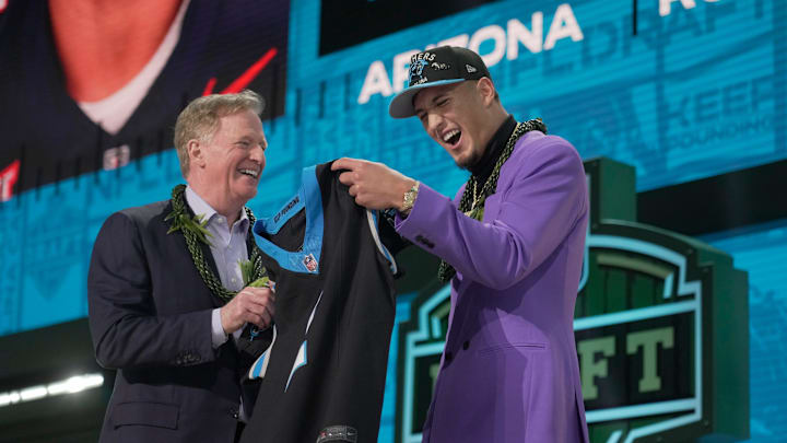NFL Commissoner Rodger Goodell, left, with Arizona Wildcats wide receiver Tetairoa McMillan selected by the Carolina Panthers as the number eight pick in the first round of the 2025 NFL Draft at Lambeau Field.