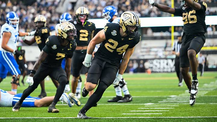 Nov 22, 2025; Nashville, Tennessee, USA;  Vanderbilt Commodores linebacker Nick Rinaldi (24) celebrates the sack of Kentucky Wildcats quarterback Cutter Boley (8) during the first half at FirstBank Stadium. Mandatory Credit: Steve Roberts-Imagn Images