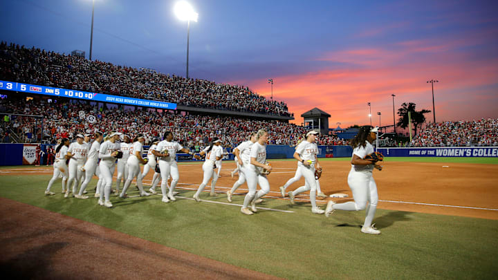 The sun sets during Game 2 of the NCAA softball Women's College World Series Championship Series game between the Oklahoma Sooners (OU) and Texas Longhorns at Devon Park in Oklahoma City, Thursday, June 6, 2024. Oklahoma won 8-4.