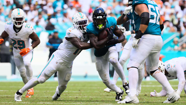 Miami Dolphins linebacker David Long Jr. (11) looks to bring down Jacksonville running back Tank Bigsby during the third quarter of the 2024 season opener at Hard Rock Stadium. Miami Dolphins linebacker David Long Jr. (11) looks to bring down Jacksonville running back Tank Bigsby during the third quarter of the 2024 season opener at Hard Rock Stadium.
