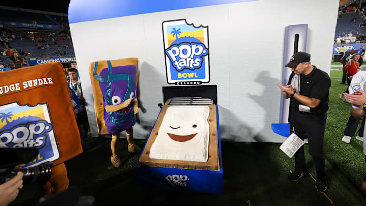 Dec 28, 2024; Orlando, FL, USA; Iowa State Cyclones head coach Matt Campbell celebrates after beating Miami Hurricanes in the Pop Tarts bowl at Camping World Stadium. Mandatory Credit: Nathan Ray Seebeck-Imagn Images Dec 28, 2024; Orlando, FL, USA; Iowa State Cyclones head coach Matt Campbell celebrates after beating Miami Hurricanes in the Pop Tarts bowl at Camping World Stadium. Mandatory Credit: Nathan Ray Seebeck-Imagn Images