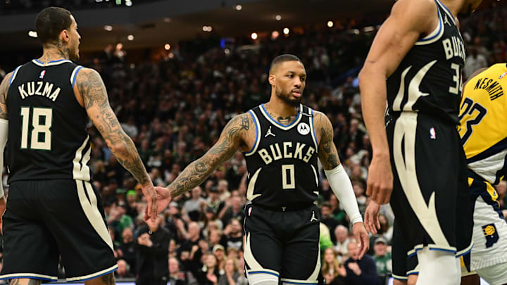 Apr 27, 2025; Milwaukee, Wisconsin, USA: Milwaukee Bucks guard Damian Lillard (0) reacts with forward Kyle Kuzma (18) in the first quarter against the Indiana Pacers during game four of first round for the 2024 NBA Playoffs at Fiserv Forum. Lillard left the game early in the in the first quarter with an injury. Mandatory Credit: Benny Sieu-Imagn Images Apr 27, 2025; Milwaukee, Wisconsin, USA: Milwaukee Bucks guard Damian Lillard (0) reacts with forward Kyle Kuzma (18) in the first quarter against the Indiana Pacers during game four of first round for the 2024 NBA Playoffs at Fiserv Forum. Lillard left the game early in the in the first quarter with an injury. Mandatory Credit: Benny Sieu-Imagn Images