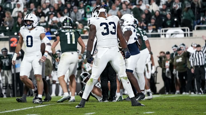 Nov 15, 2025; East Lansing, Michigan, USA; Penn State defensive end Dani Dennis-Sutton (33) celebrates a sack on Michigan State quarterback Alessio Milivojevic (11) in the fourth quarter at Spartan Stadium.