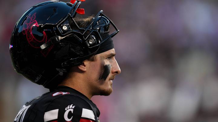 Sep 26, 2026; Cincinnati, Ohio, USA;  Cincinnati Bearcats quarterback JC French IV (4) watches from the sideline during the game against the Kansas State Wildcats in the first half at Nippert Stadium. Mandatory Credit: Aaron Doster-Imagn Images