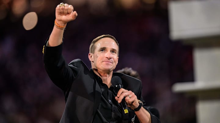 Oct 17, 2024; New Orleans, Louisiana, USA; New Orleans Saints retired quarterback Drew Brees (9) reacts during his hall of fame ceremony at halftime against the Denver Broncos at Caesars Superdome. Mandatory Credit: Matthew Hinton-Imagn Images