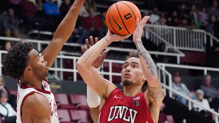 UNLV Runnin' Rebels guard Dra Gibbs-Lawhorn (0) shoots against Stanford Cardinal guard Ebuka Okorie (1) in the second half at Maples Pavilion. Mandatory Credit: David Gonzales-Imagn Images