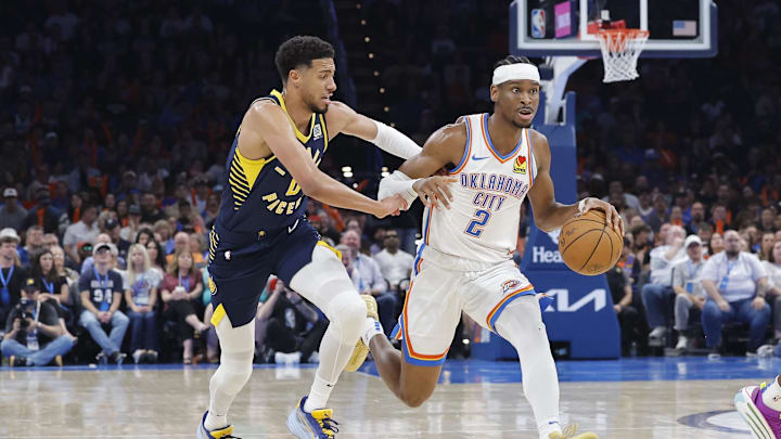 Mar 29, 2025; Oklahoma City, Oklahoma, USA; Oklahoma City Thunder guard Shai Gilgeous-Alexander (2) drives to the basket beside Indiana Pacers guard Tyrese Haliburton (0) during the second quarter at Paycom Center. Mandatory Credit: Alonzo Adams-Imagn Images Mar 29, 2025; Oklahoma City, Oklahoma, USA; Oklahoma City Thunder guard Shai Gilgeous-Alexander (2) drives to the basket beside Indiana Pacers guard Tyrese Haliburton (0) during the second quarter at Paycom Center. Mandatory Credit: Alonzo Adams-Imagn Images