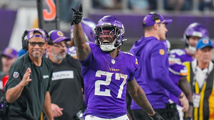 Dec 29, 2024; Minneapolis, Minnesota, USA; Minnesota Vikings running back Cam Akers (27) celebrates his catch against Green Bay Packers in the fourth quarter at U.S. Bank Stadium.