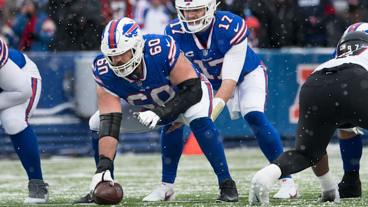 Jan 2, 2022; Orchard Park, New York, USA; Buffalo Bills quarterback Josh Allen (17) and center Mitch