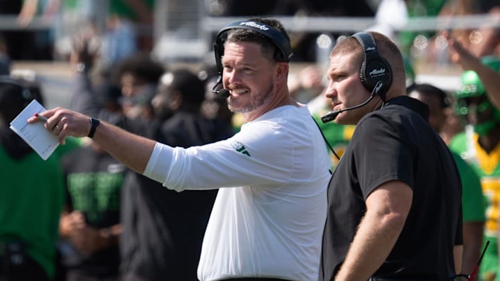 Oregon Head Coach Dan Lanning, left, and Defensive Coordinator Tosh Lupoi discus their game plan during the game against Oklahoma State. Oregon Head Coach Dan Lanning, left, and Defensive Coordinator Tosh Lupoi discus their game plan during the game against Oklahoma State.