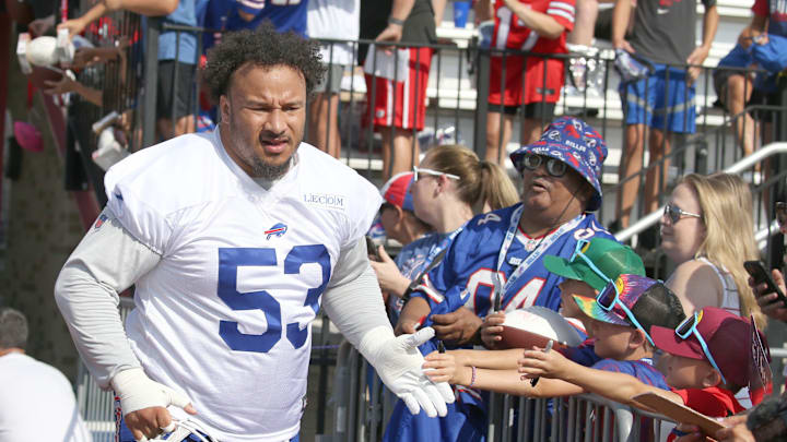 Bills offensive lineman Kendrick Green high-fives fans as the takes the field during the second day of Buffalo Bills training camp at St. John Fisher University Thursday, July 24, 2025 in Pittsford.