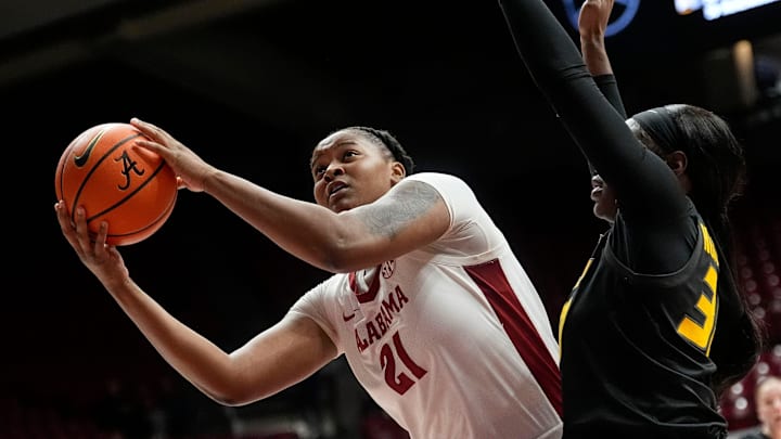 Jan 5, 2025; Tuscaloosa, AL, USA; Alabama forward Essence Cody (21) gets a shot in the lane with Missouri forward Angelique Ngalakulondi (30) defending at Coleman Coliseum. Jan 5, 2025; Tuscaloosa, AL, USA; Alabama forward Essence Cody (21) gets a shot in the lane with Missouri forward Angelique Ngalakulondi (30) defending at Coleman Coliseum.