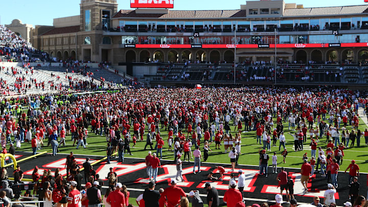 Nov 8, 2025; Lubbock, Texas, USA; Fans fill the field after the game between the Texas Tech Red Raiders and the Brigham Young Cougars at Jones AT&T Stadium. Mandatory Credit: Michael C. Johnson-Imagn Images Nov 8, 2025; Lubbock, Texas, USA; Fans fill the field after the game between the Texas Tech Red Raiders and the Brigham Young Cougars at Jones AT&T Stadium. Mandatory Credit: Michael C. Johnson-Imagn Images